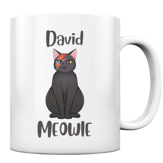 Weiße Tasse. Motiv: Eine graue Katze, die einen blau-roten Blitz im Gesicht hat. Dazu der Schriftzug "David Meowie"
